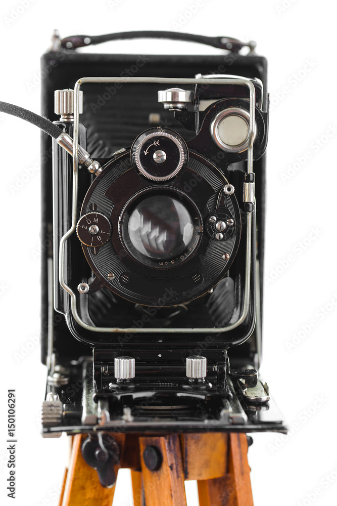 Old camera on a tripod on a white background Old camera on a tripod on a white background