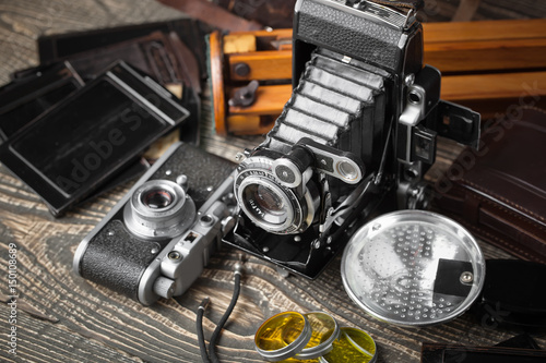 Old camera on an old background on a close-up table photo