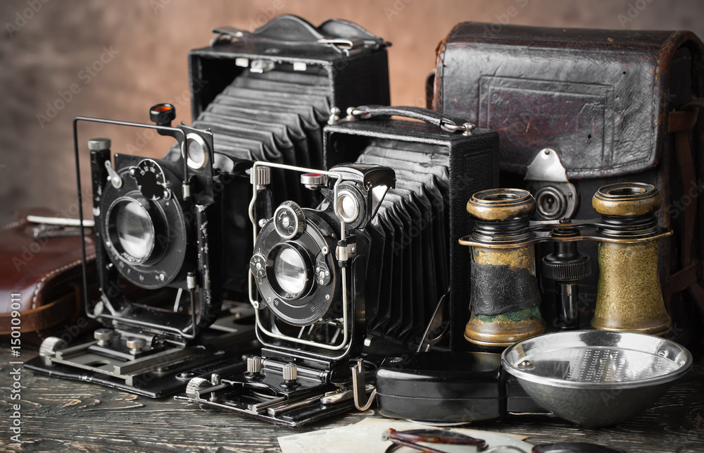 Old camera on an old background on a close-up table