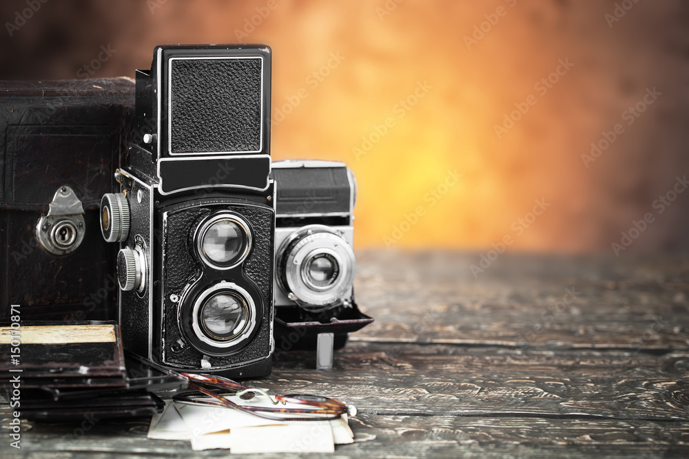 Old camera on an old background on a close-up table