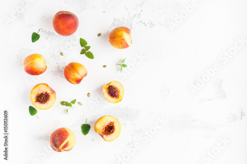 Fresh peaches on white background. Summer peaches. Flat lay, top view, copy space
