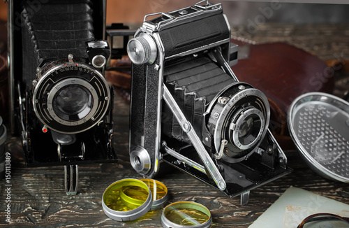 Old camera on an old background on a close-up table