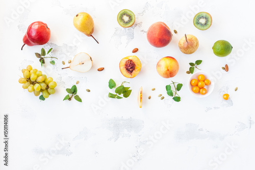 Fototapeta Naklejka Na Ścianę i Meble -  Fresh fruits on white background. Flat lay, top view, copy space