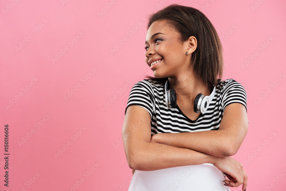 Portrait of a casual african woman posing on a chair Portrait of a casual african woman posing on a chair