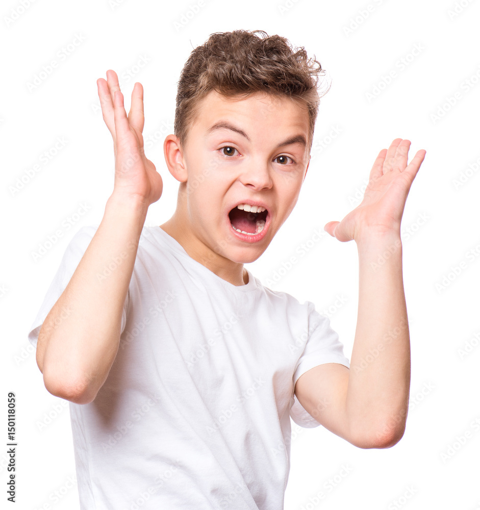 Emotional portrait of amazed or surprised teen boy in white t-shirt. Funny cute cheerful child screaming with wide open mouth, isolated on white background. Emotional portrait of amazed or surprised teen boy in white t-shirt. Funny cute cheerful child screaming with wide open mouth, isolated on white background.