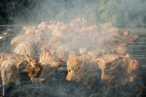 grilled Caucasus barbecue in smoke. Shallow depth of field