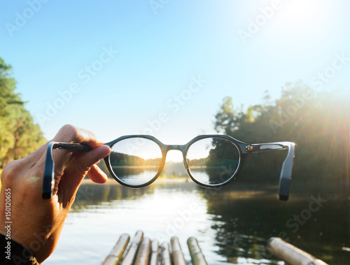 Traveling in the middle of the lake. Hand-held glasses scene is mountain focus