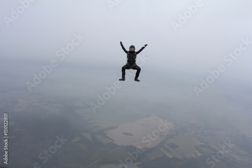 Skydiver girl in the cloud