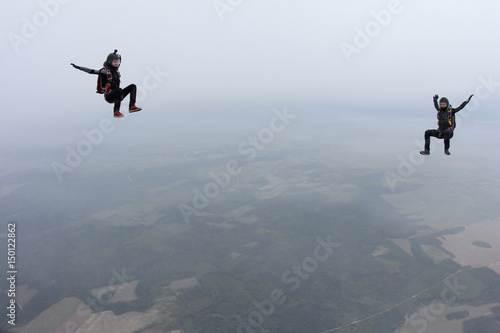 Two skydivers in the sky