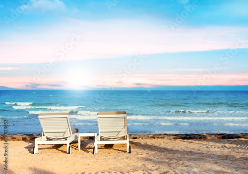 Beach chairs on the sand beach with cloudy blue sky, Relax, vacation time © Nattawut Thammasak