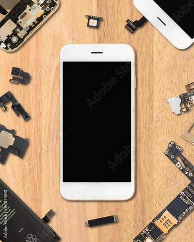 Quadro em tela Flat Lay (Top view) of smartphone is surrounded by its own components on wooden
