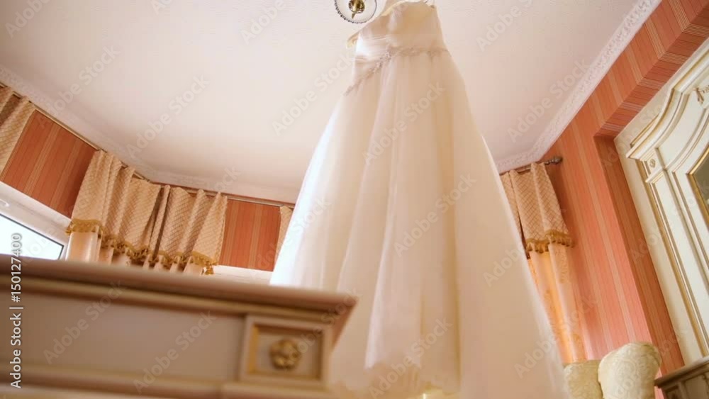 The perfect wedding dress in the room of the bride. The perfect wedding dress in the room of the bride.