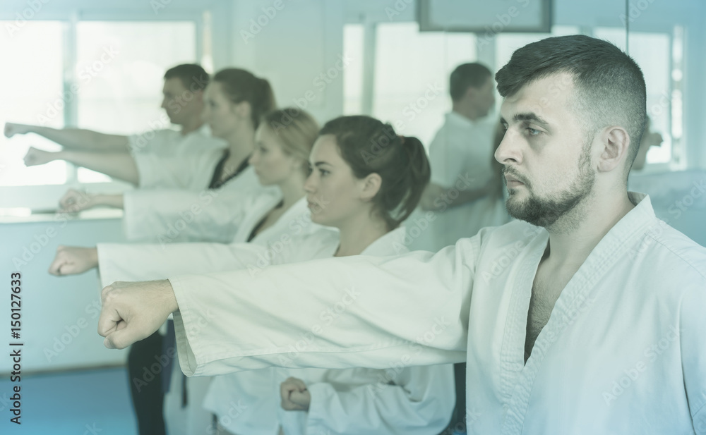 Obraz premium trainees expressing interest in attending karate class
