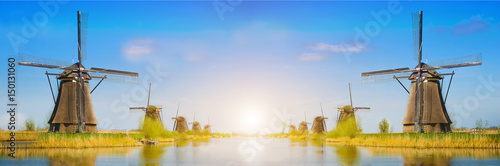 Obraz na płótnie Magic panorama spring landscape with tulips and aircraft Mill in Kinderdijk, Netherlands, Europe at dawn (harmony, relaxation, anti-stress, meditation - concept). w salonie