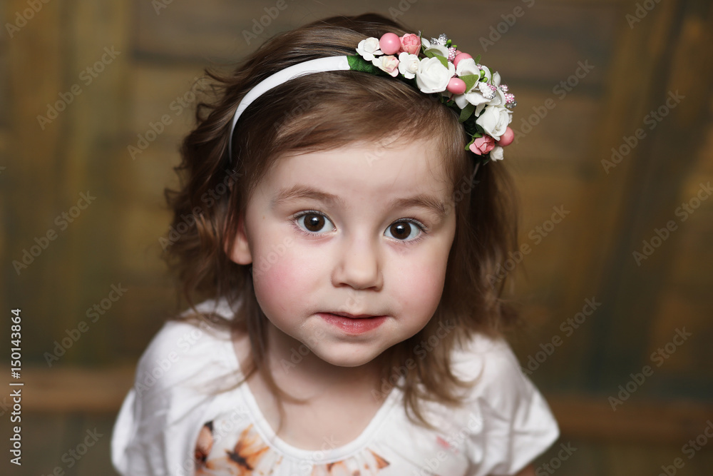 Little girl with curly hair, having fun while posing Little girl with curly hair, having fun while posing