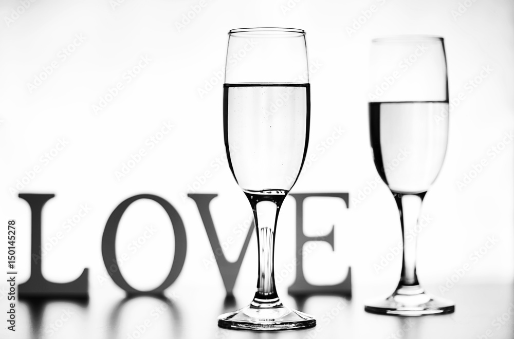 monochrome photo of champagne on white table on white background isolate