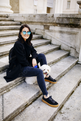 Beautiful girl sitting on s...