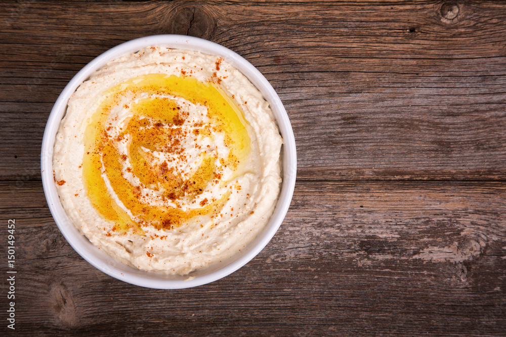 Bowl of hummus with olive oil and paprika Bowl of hummus with olive oil and paprika