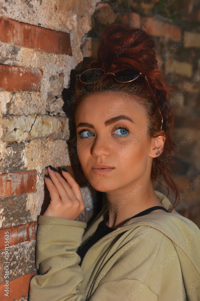 Portrait of a beautiful redhead with blue eyes