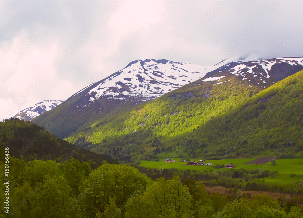 A small Norwegian village in the mountains. Beautiful Scandinavian mountain landscape.
