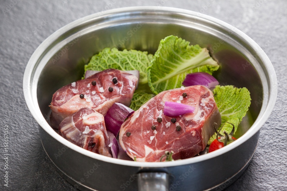 Sirloin chops and ingredients in frying pan Sirloin chops and ingredients in frying pan