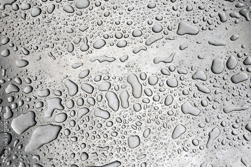 Texture of smooth metal surface with water drops.