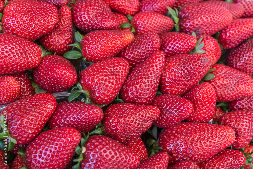 group of fresh ripe red vivid strawberries in summer market group of fresh ripe red vivid strawberries in summer market