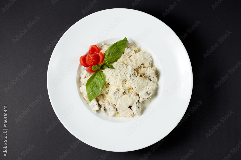 Fettuccine with chicken and mushrooms. Italian style. Italian food. Italian cuisine.