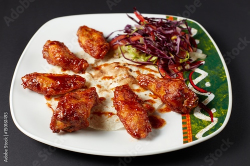 Chicken wings in Mexican style. Mexican food. Mexican cuisine.
