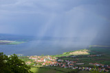 View of hilly landscape of Palava with forests, rocks and lake Nove Mlyny in South Moravia under the sky with clouds in the rain
