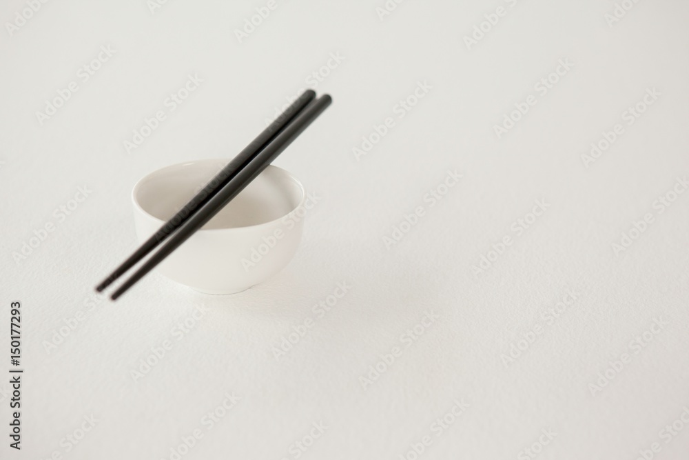 Pair of chopsticks over a bowl Pair of chopsticks over a bowl