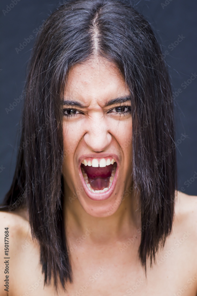 Portrait of a beautiful woman with mouth wide open as if screaming Portrait of a beautiful woman with mouth wide open as if screaming