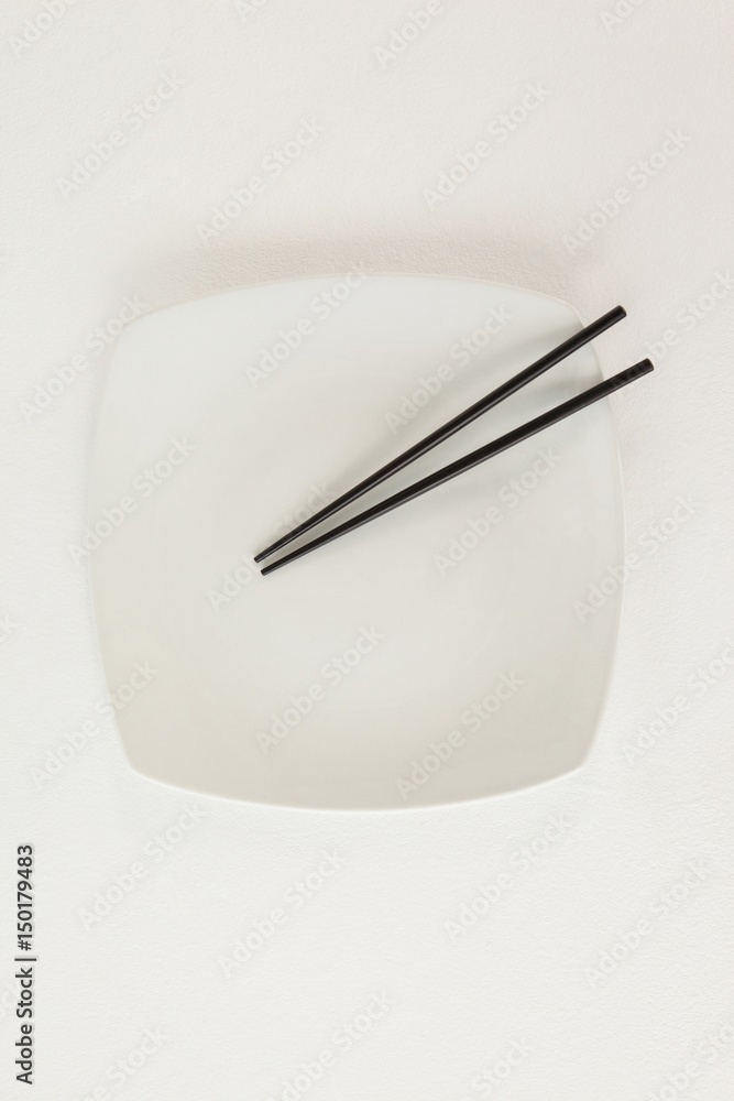 Pair of chopsticks on a plate Pair of chopsticks on a plate