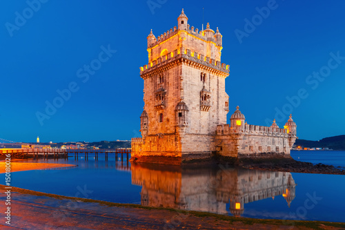 Belem Tower or Tower of St Vincent on the bank of the Tagus River during evening blue hour, Lisbon, Portugal