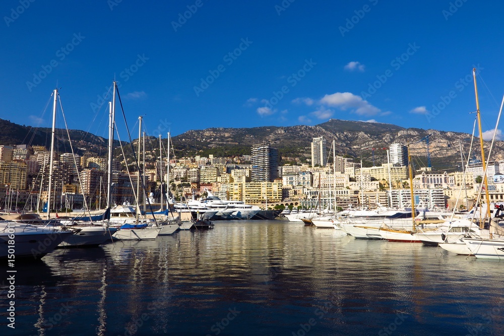 Monaco harbor Port Hercule view of yachts from water’s edge
