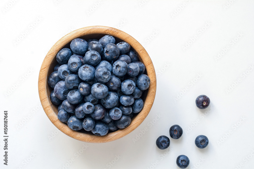 Bowl of blueberries isolated on white. Top view Bowl of blueberries isolated on white. Top view