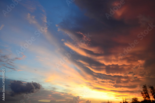 Clouds of different shapes and colors before sunset. Dramatic sky colors at sunset. Sri LankaClouds of different shapes and colors before sunset. Dramatic sky colors at sunset. © Lina