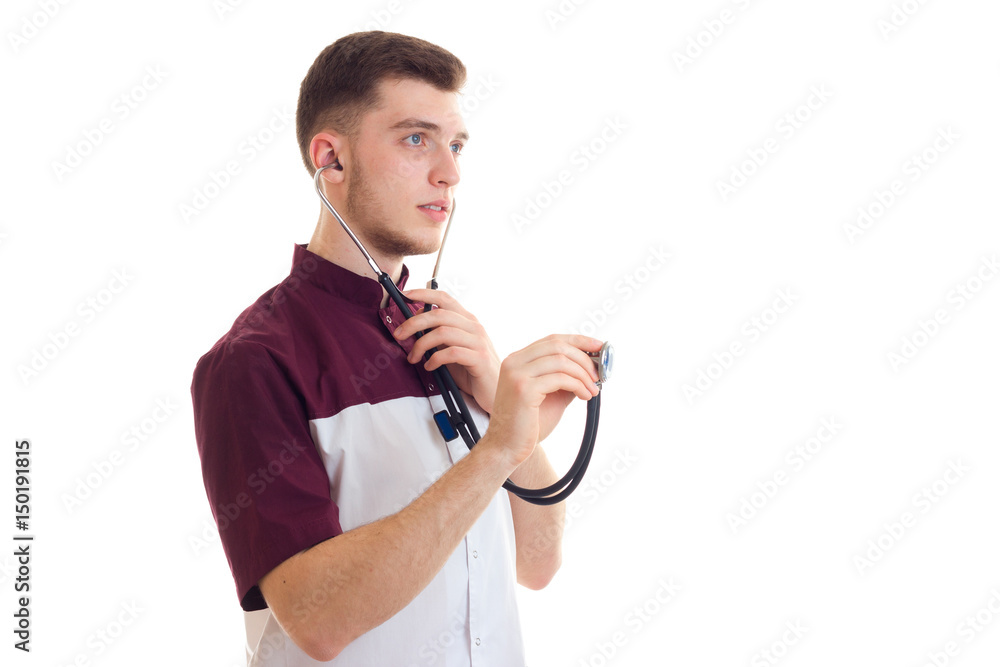 a young graduate doctor seriously keeps a stethoscope in hand a young graduate doctor seriously keeps a stethoscope in hand