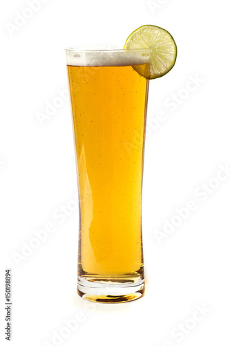 a glass of light beer and juicy lime on a white background