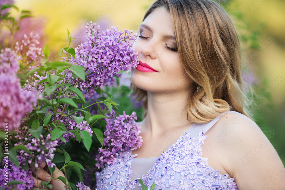 Happy pregnant girl in blossom lilac garden Happy pregnant girl in blossom lilac garden