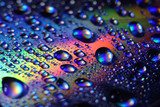 Colored rainbow water droplets on the disc