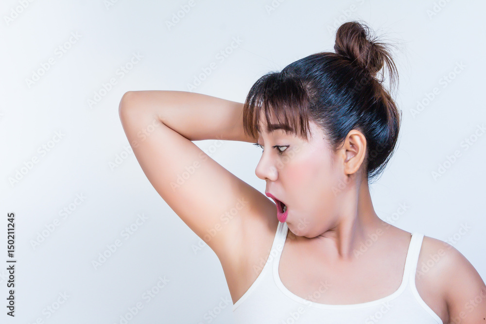 woman holding her arms up and showing underarms woman holding her arms up and showing underarms