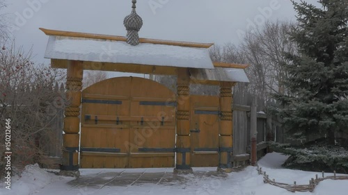Wallpaper Mural Hand Opens Wooden Gate Picturesque Wooden Church Skit of All Saints in Sviatogorskaya Lavra in Snowy Winter Man Enters the Monastery Courtyard Virtual Walk Torontodigital.ca