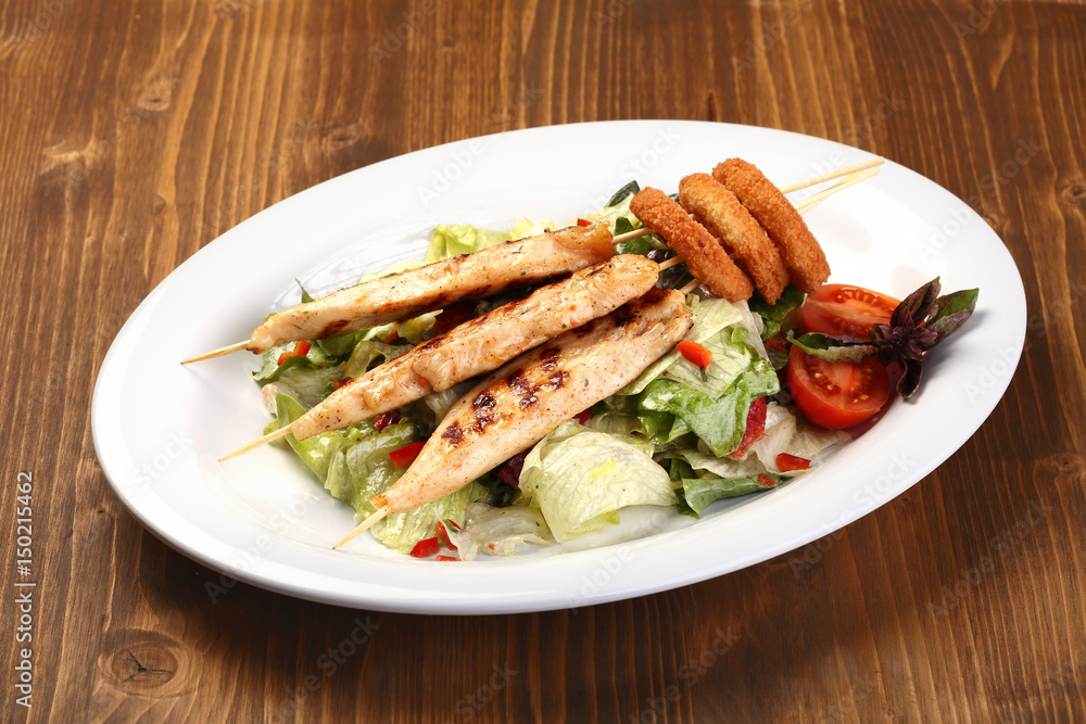 salad with grilled chicken and onion rings salad with grilled chicken and onion rings
