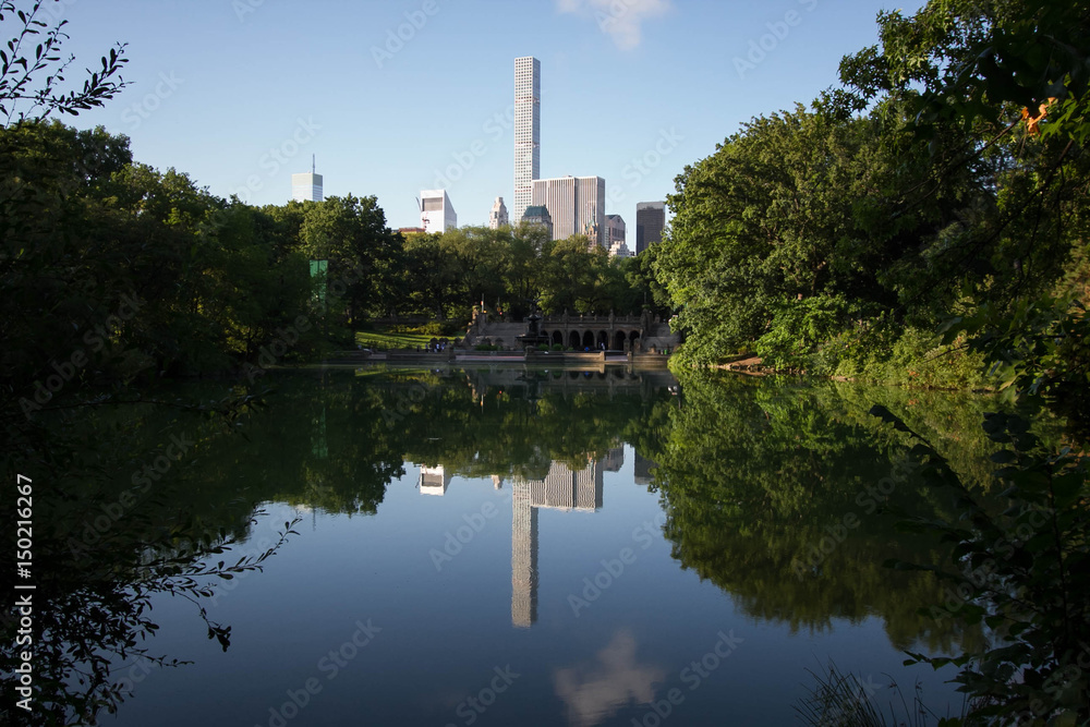 Buildings in Manhattan reflects on the lake at Central Park