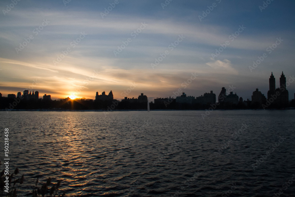 Sunset reflects on the lake in Manhattan city Sunset reflects on the lake in Manhattan city
