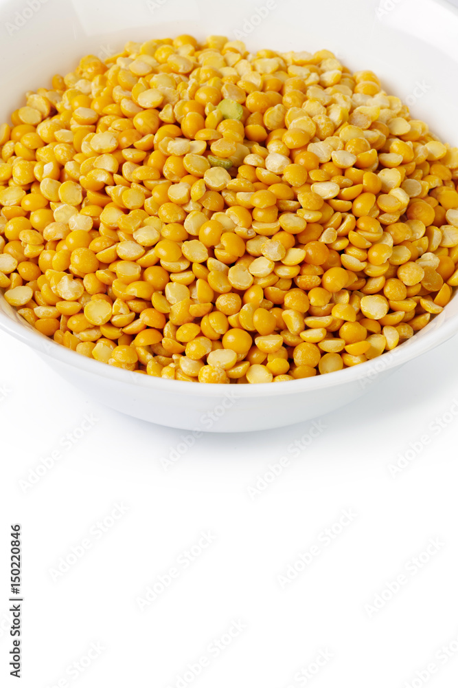 Dry yellow split peas isolated on white. Dry yellow split peas isolated on white.