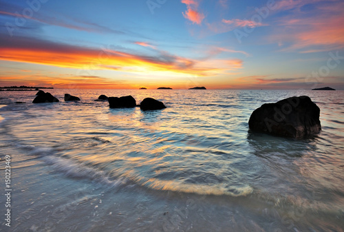 Beautiful sunset in a rocky beach in Kota Kinabalu, Sabah Borneo, Malaysia.