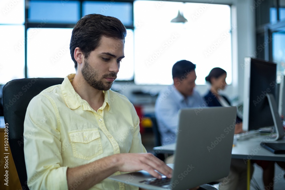 Attentive businessman using laptop Attentive businessman using laptop