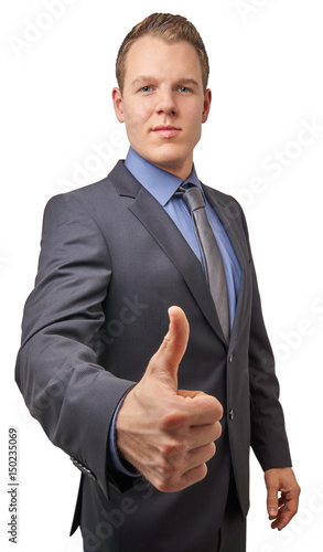 Isolated young attractive successful smiling businessman with thumb up. Business concept for advertisement. photo